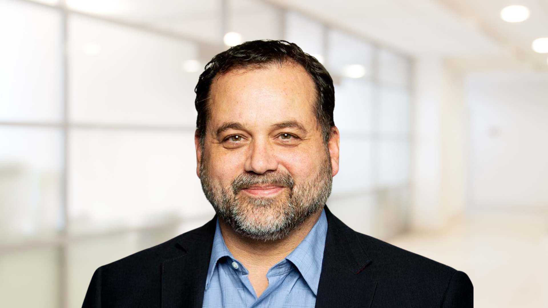 Headshot of Paul Tedesco, smiling.