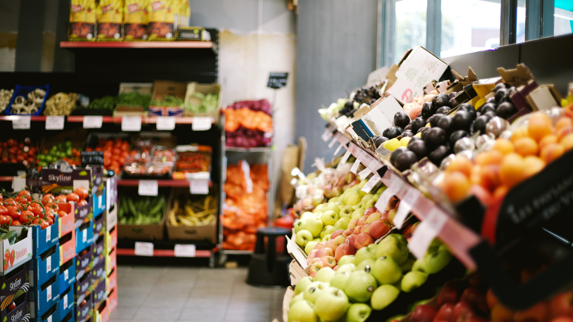 A well-stocked produce section in a grocery store, showcasing high prices.