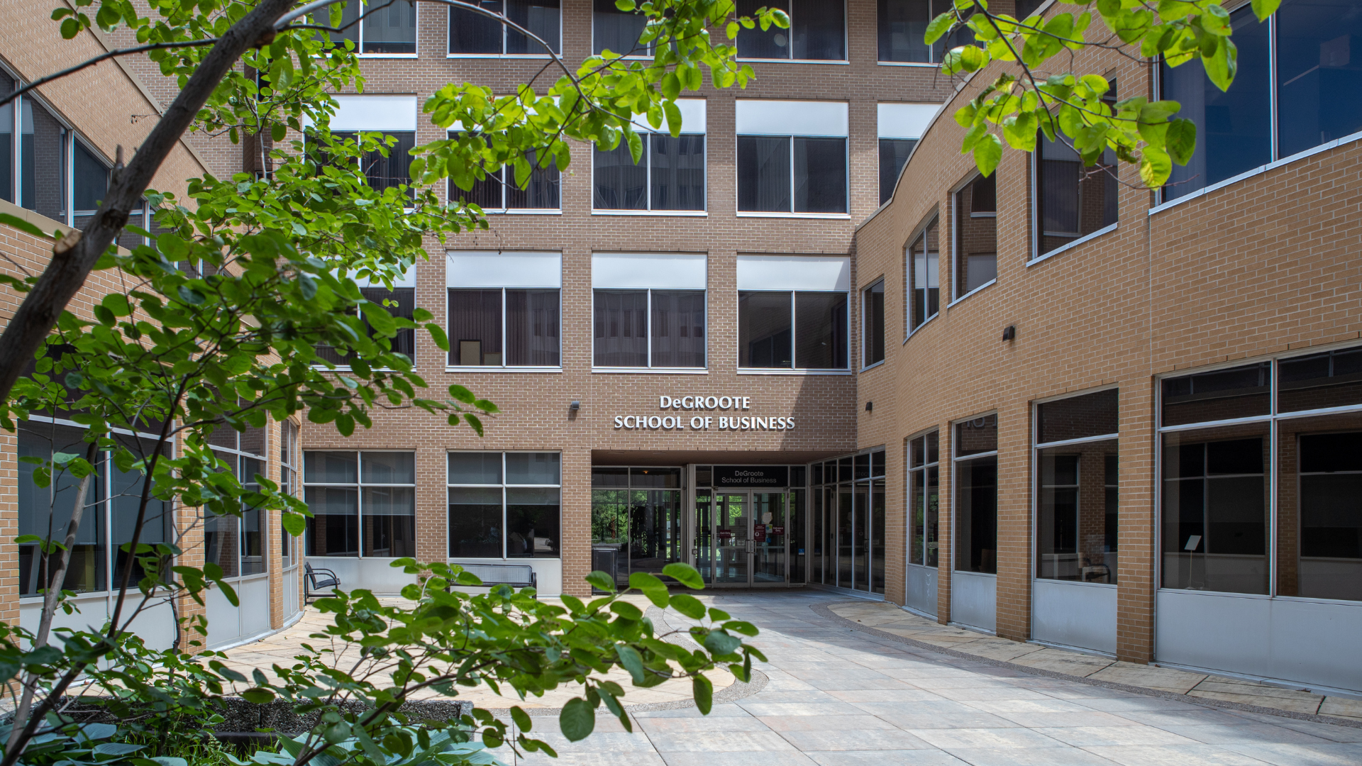 Entrance of the brick DeGroote School of Business building at McMaster University.