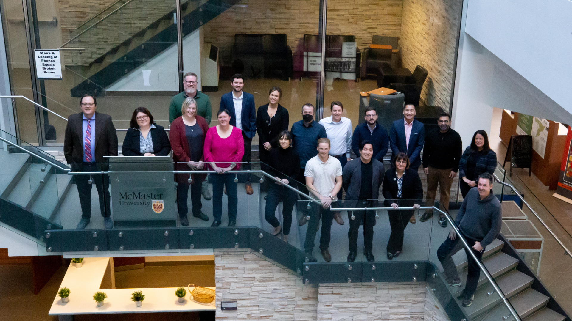 A diverse group of Conservation Halton staff members standing on a stairway.