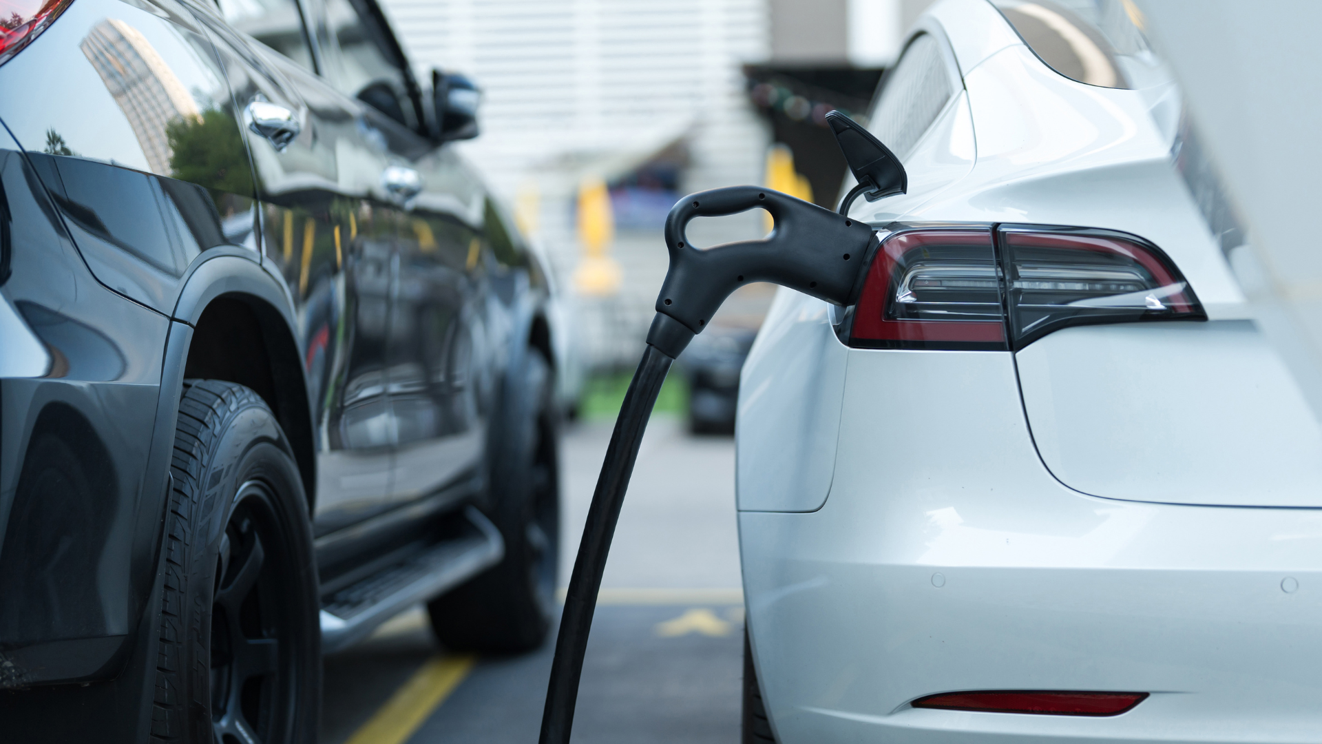 An electric car connected to a charging station.