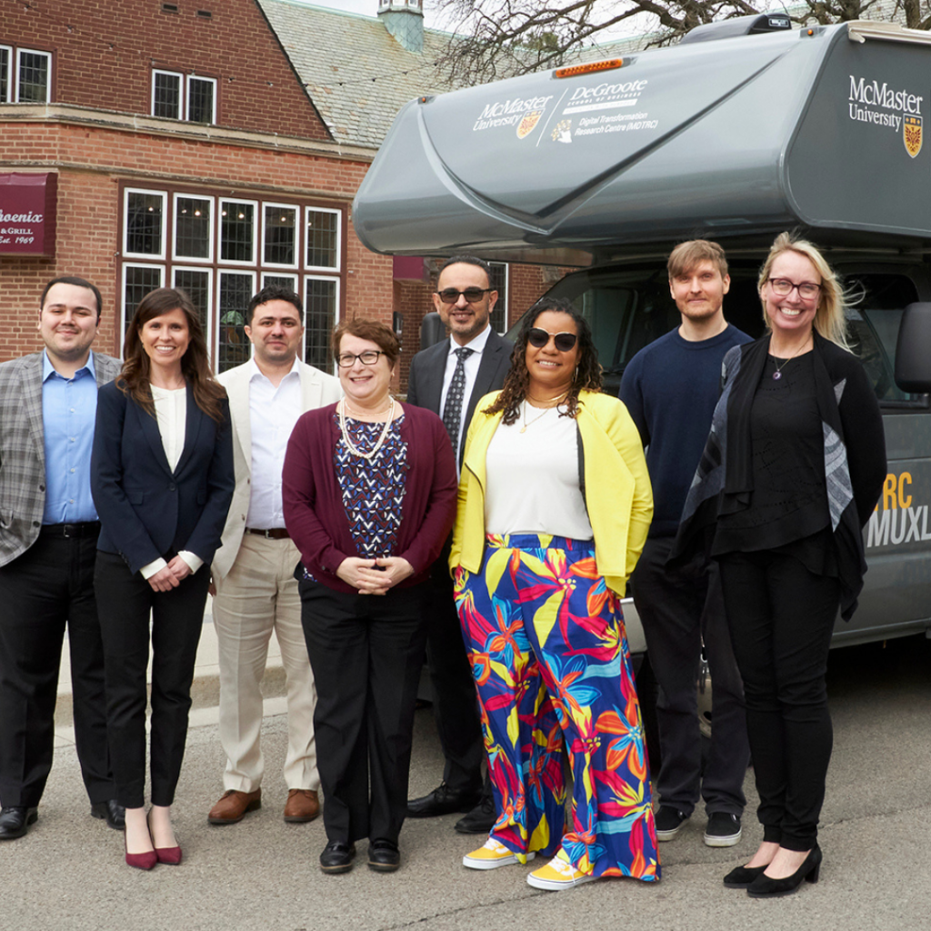 MDTRC team poses proudly in front of their new mobile research lab van, showcasing collaboration and innovation in research.