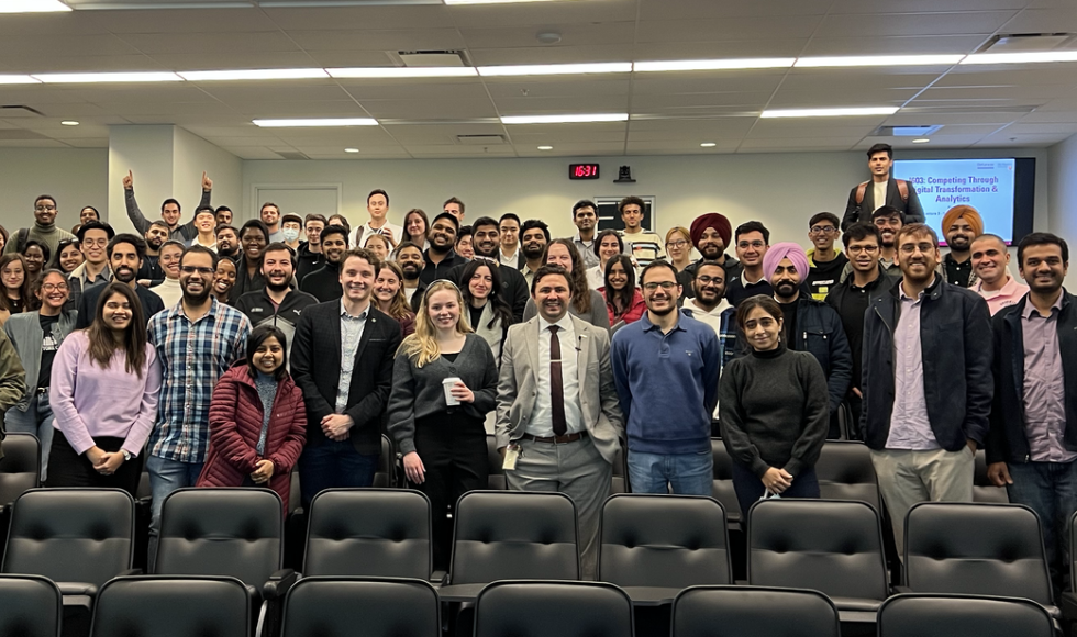 group photo featuring Nour El Shammy and his MBA students.