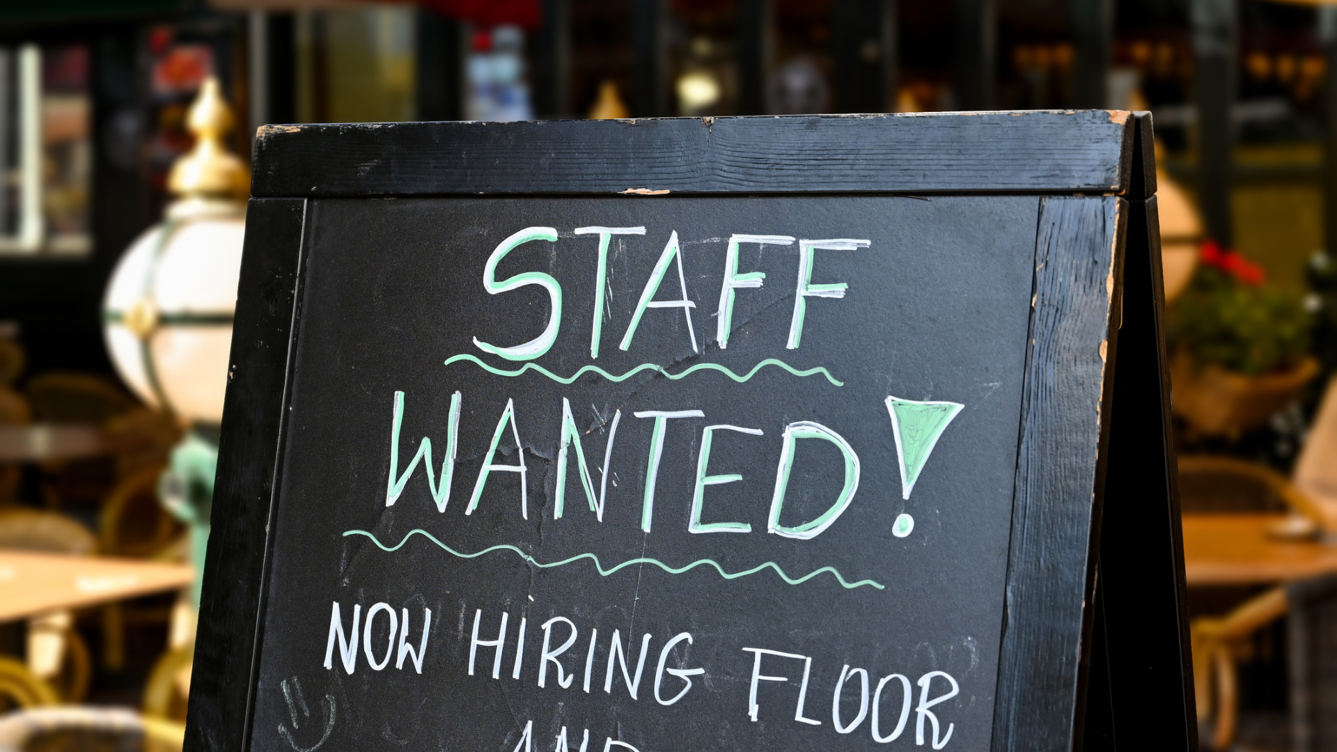 Sign saying Staff wanted, now hiring.