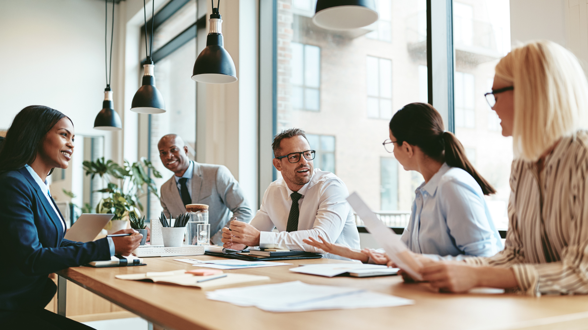 Group of individuals using Custom Professional Development Opportunities to Develop Leaders