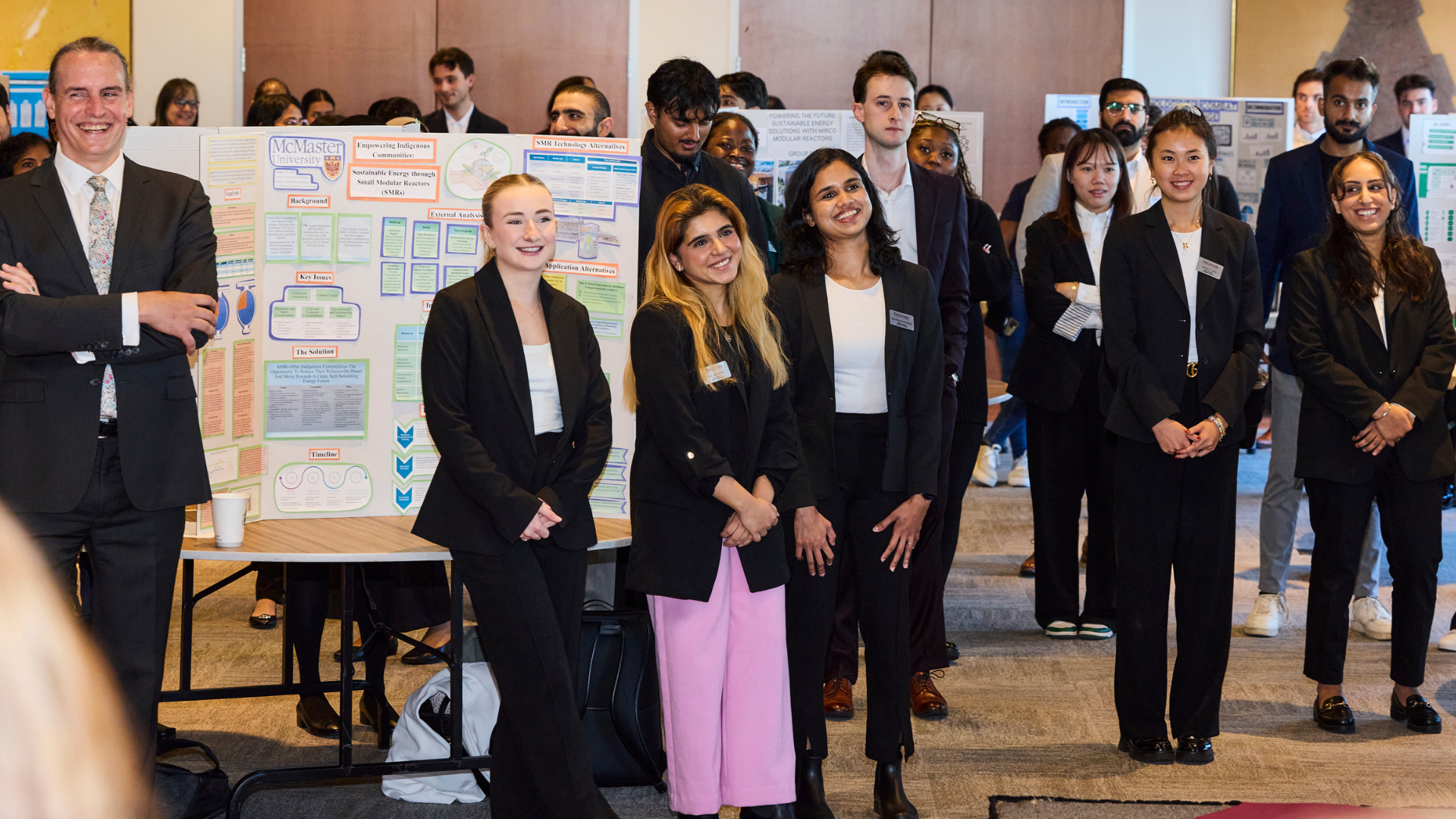 MBA students gathering during the poster presentations.