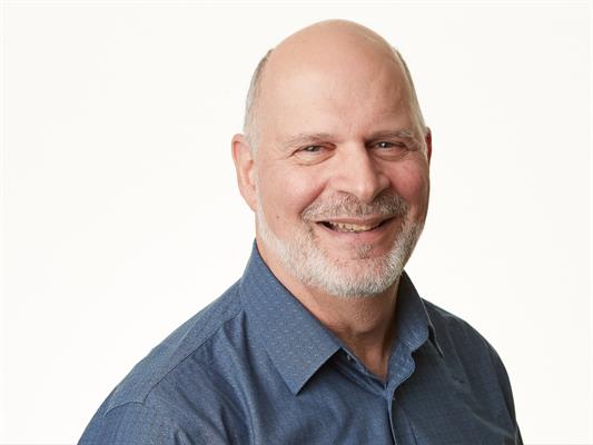 Headshot of Christopher Longo, smiling.