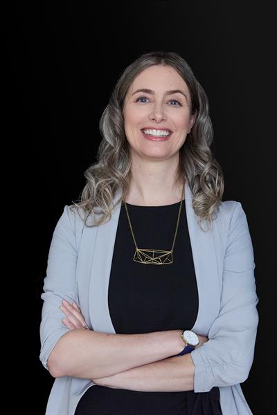 Headshot of Catherine Connelly, smiling.