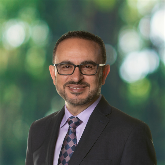 Headshot of Khaled Hassanein, smiling.