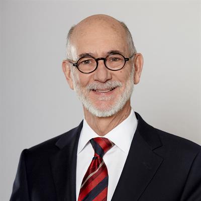 Headshot of John Medcof, smiling.