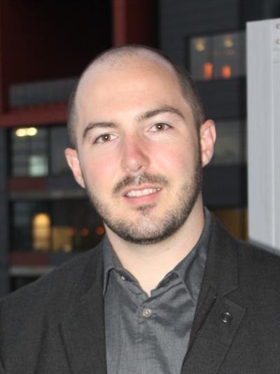 Headshot of Sean O'Brady, smiling.