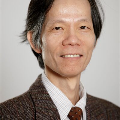 Headshot of Sherman Cheung, smiling.