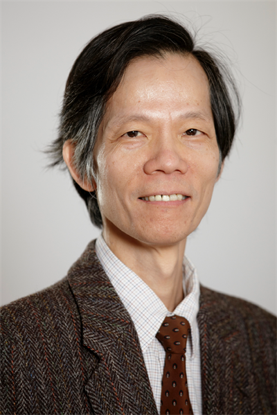 Headshot of Sherman Cheung, smiling.