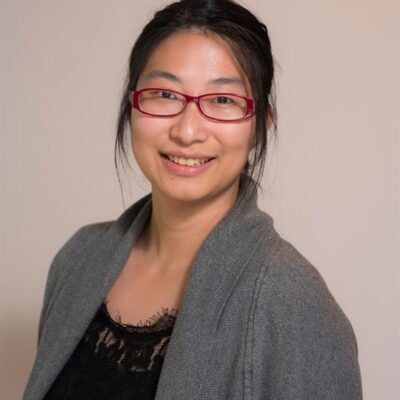 Headshot of Iris Wang, smiling.