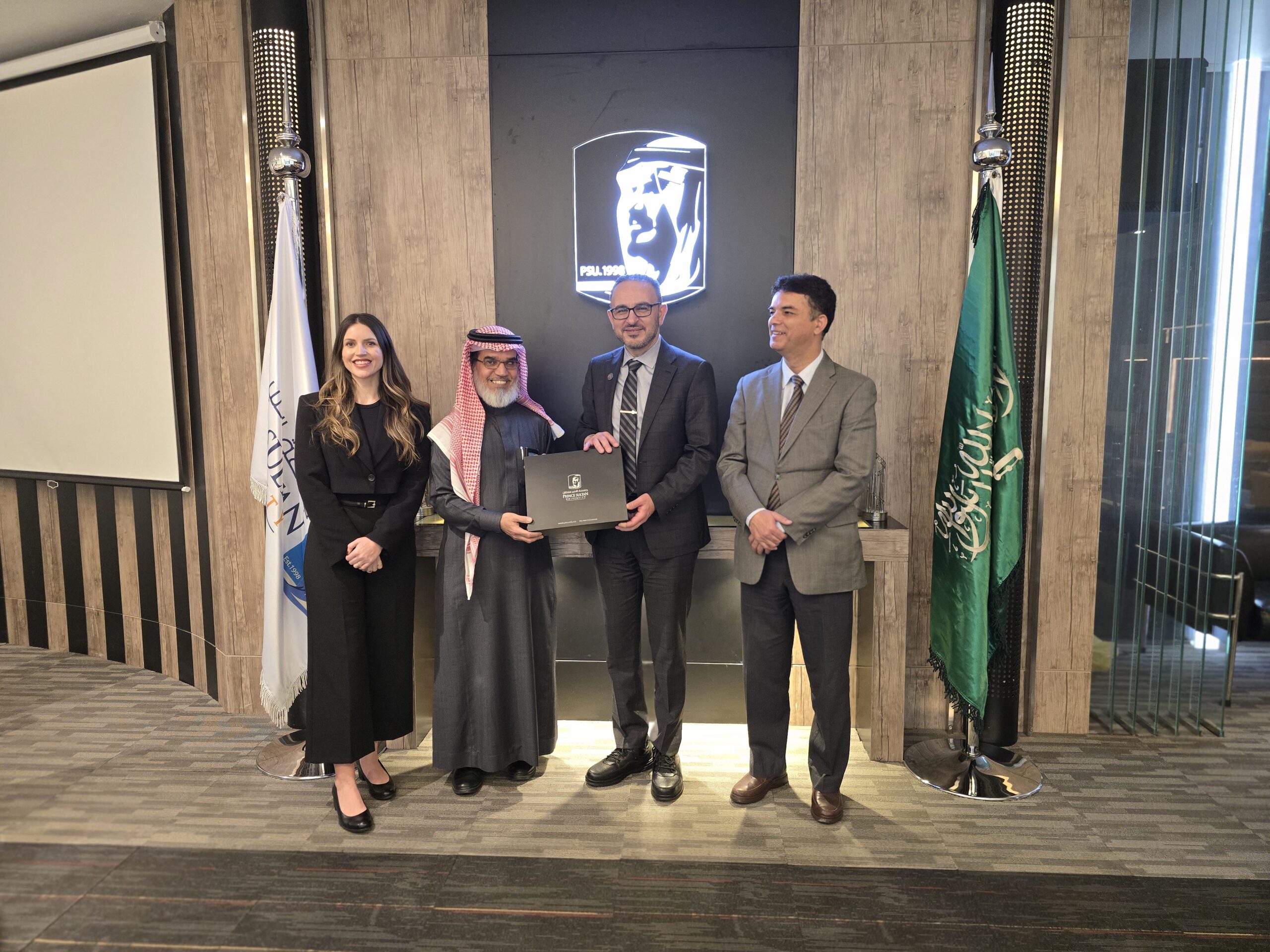 Four professionals stand together: Tiffani Nutter, Saad Almosa, Khaled Hassanein, and Saghir Mehar, representing their respective institutions.