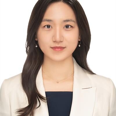 Headshot of Dr. Judy Han, smiling.