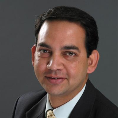 Headshot of Dr. Ashish Pujari, smiling.