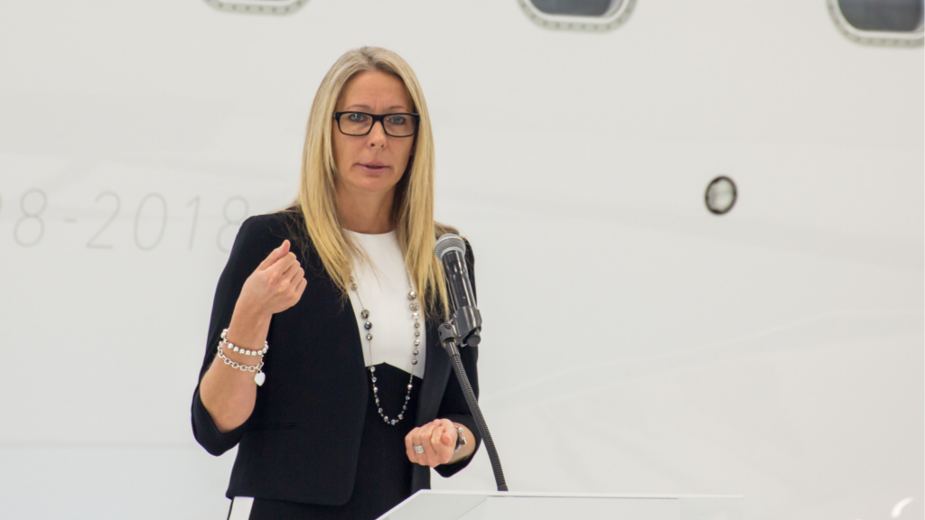 Nancy Barber speaking into a microphone