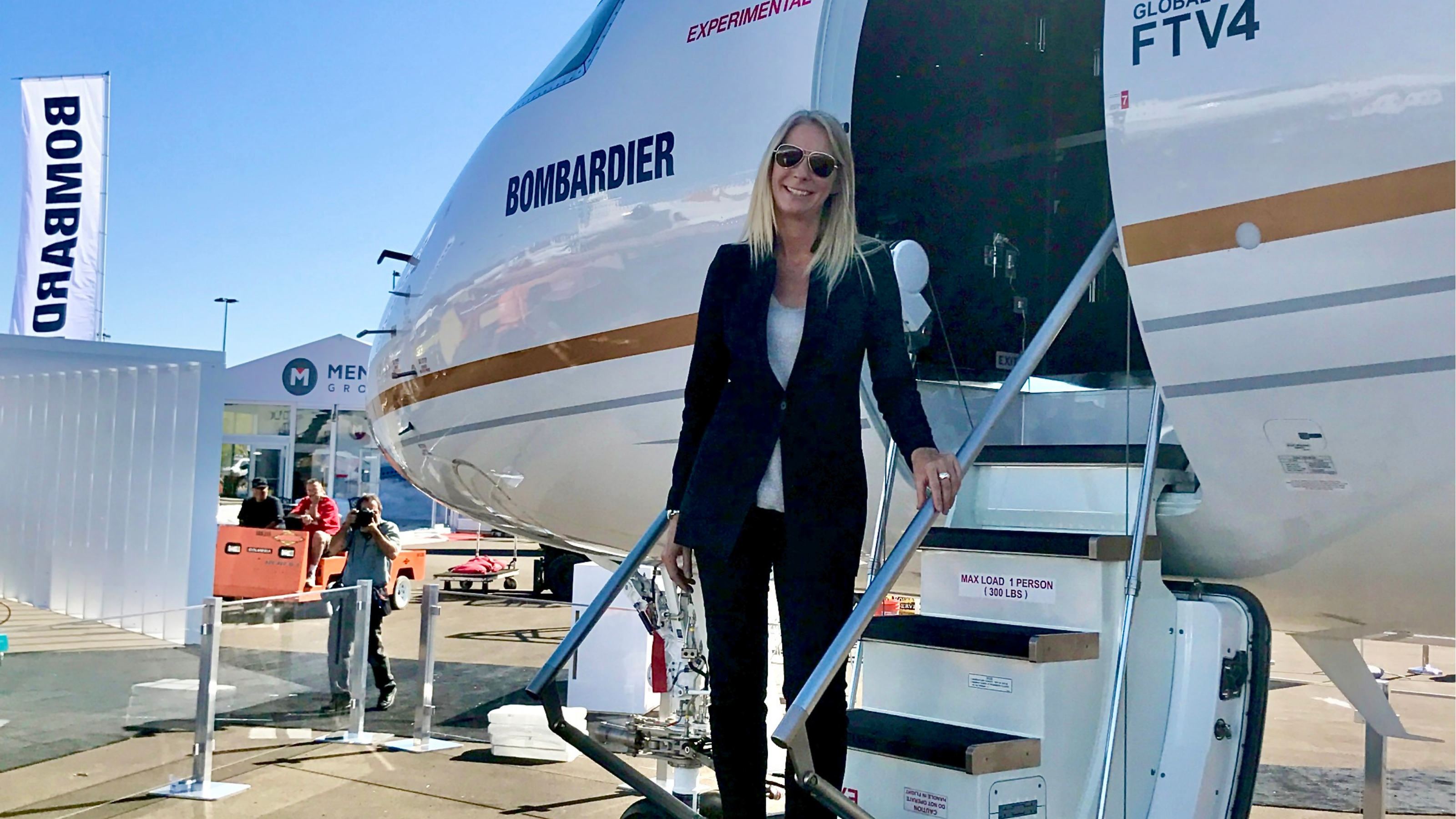 Nancy Barber standing on airplane steps