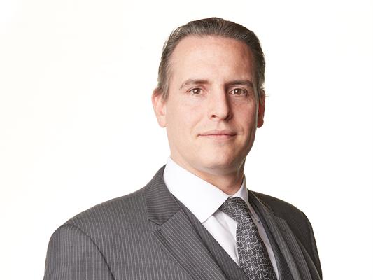 Headshot of William Huggins