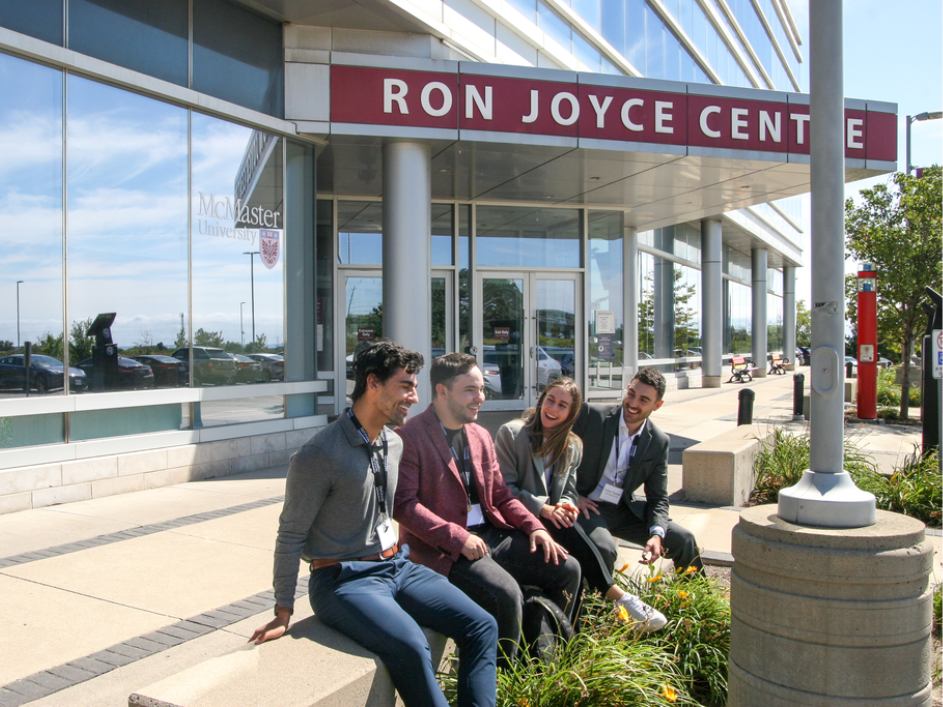 Students sitting outside the Ron Joyce Centre