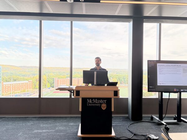 Ian Finlay, TMX Industry Professor, speaks to students in the Allen H. Gould Trading Floor.